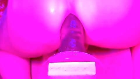 Amature brunette gives a handjob to a toy and gets horny