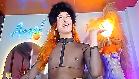 Redheaded redhead with a tattooed body is having fun alone