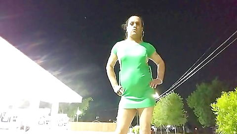 Amateur brunette in a dress gets off in the public